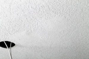 Textured ceiling with holes for lights