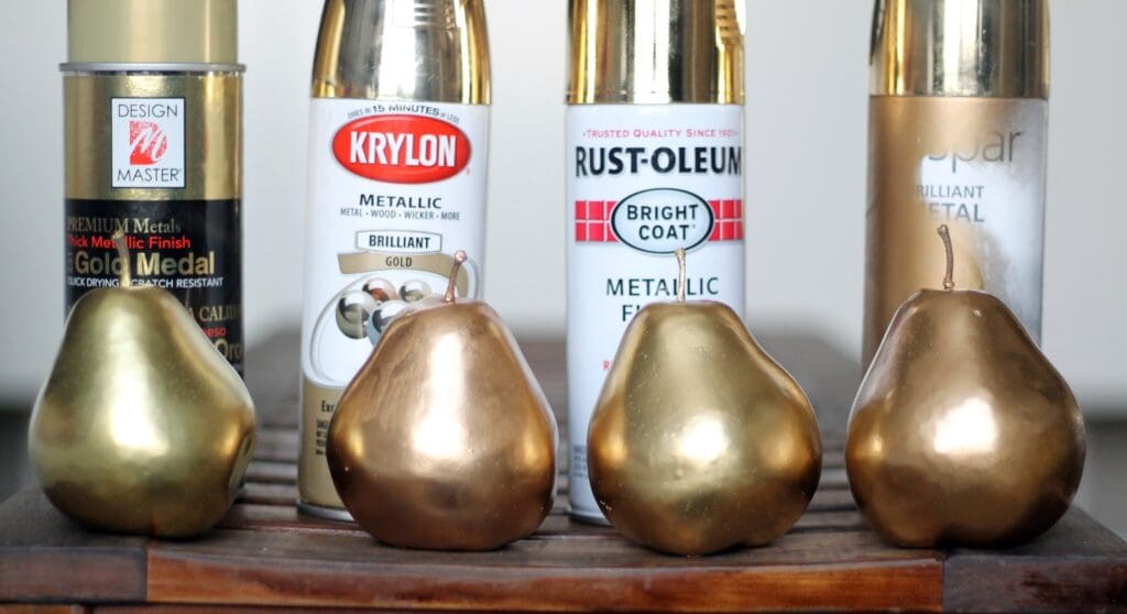 Pears spray-painted in four shades of gold