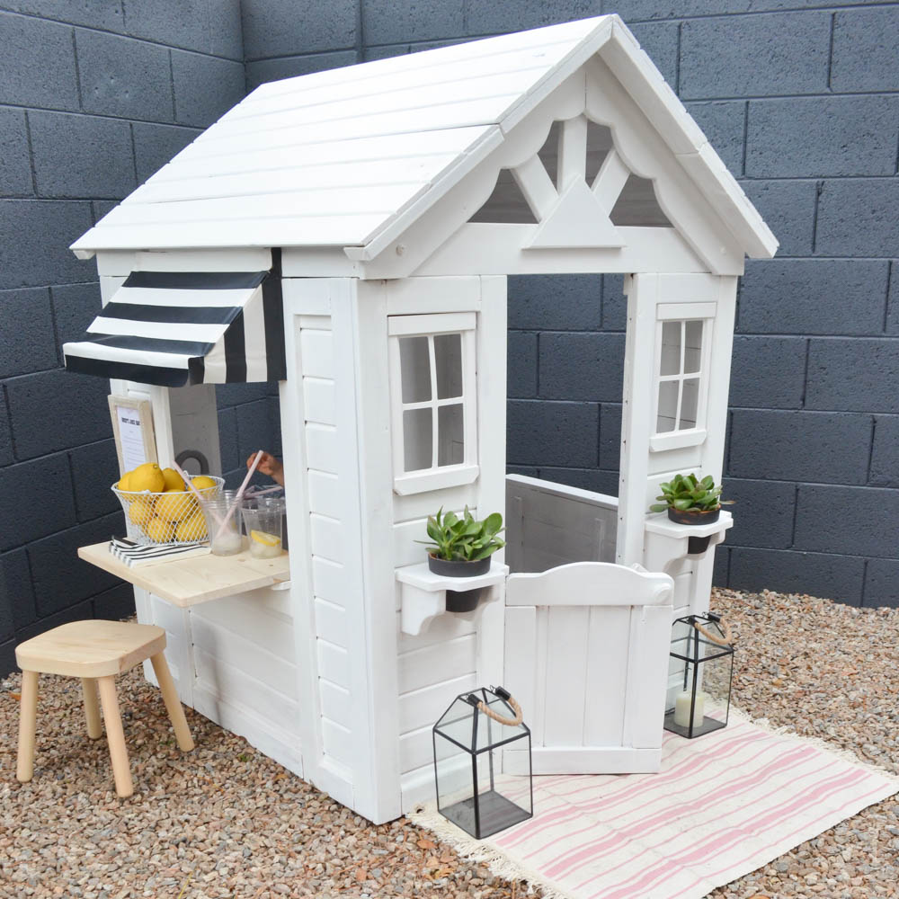 white wooden playhouse