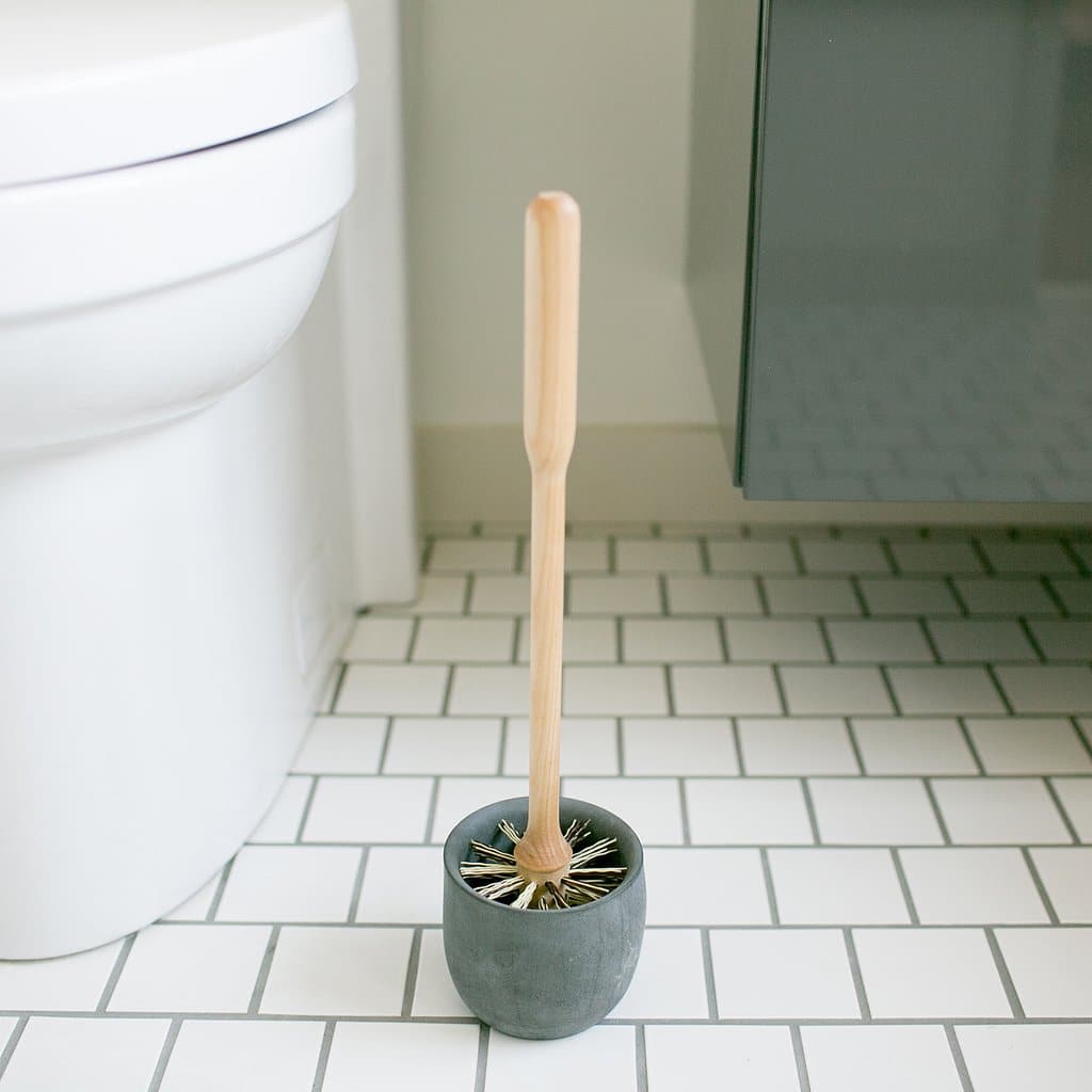 Toilet brush end stuck in drain, what can we do. : r/Plumbing