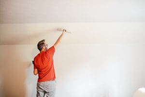 Skimming a textured wall before hanging wallpaper
