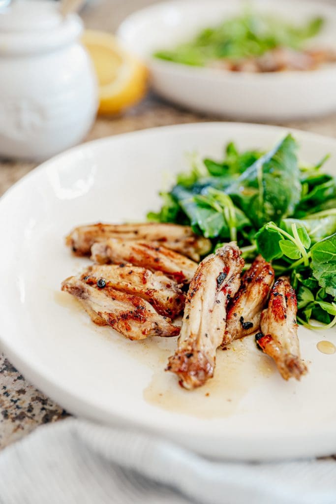 Bee sting chicken wings on a white plate