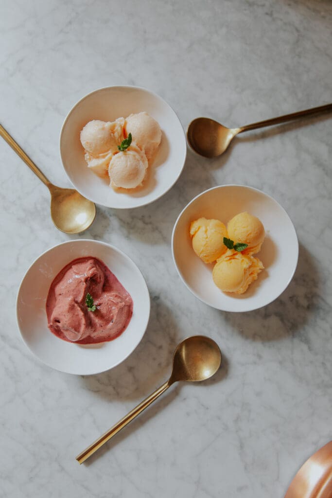 Three frozen desserts in pretty pastel colors