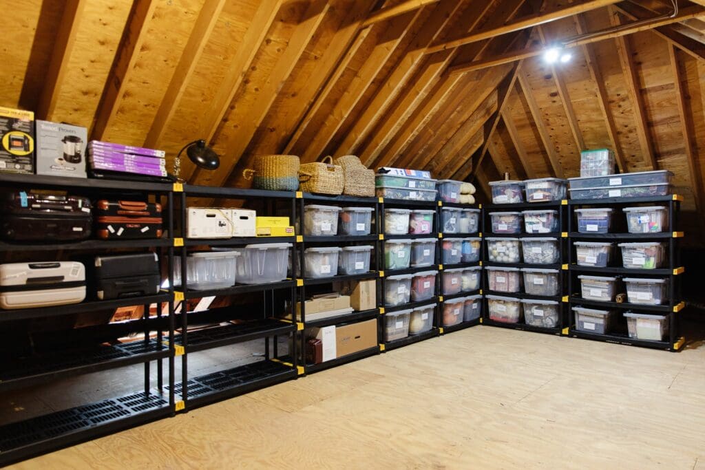 Attic with storage bins and shelves