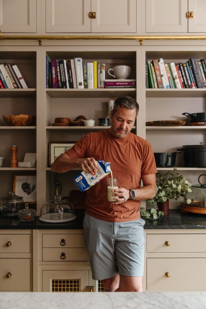 Chris Loves Julia | Chris pouring plant milk into a cup