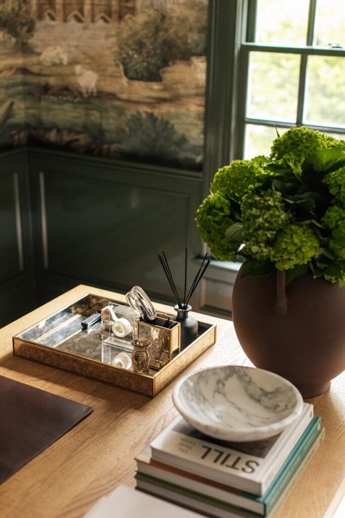 Chris Loves Julia | Desk view with small mirrored tray holding scissors, tape and a diffuser