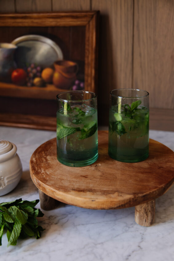 Virgin Mojito with Cucumber and Honey Nojito, refreshing non-alcoholic drink featuring fresh mint, cucumber slices, and honey, served in clear glasses on a rustic wooden tray.