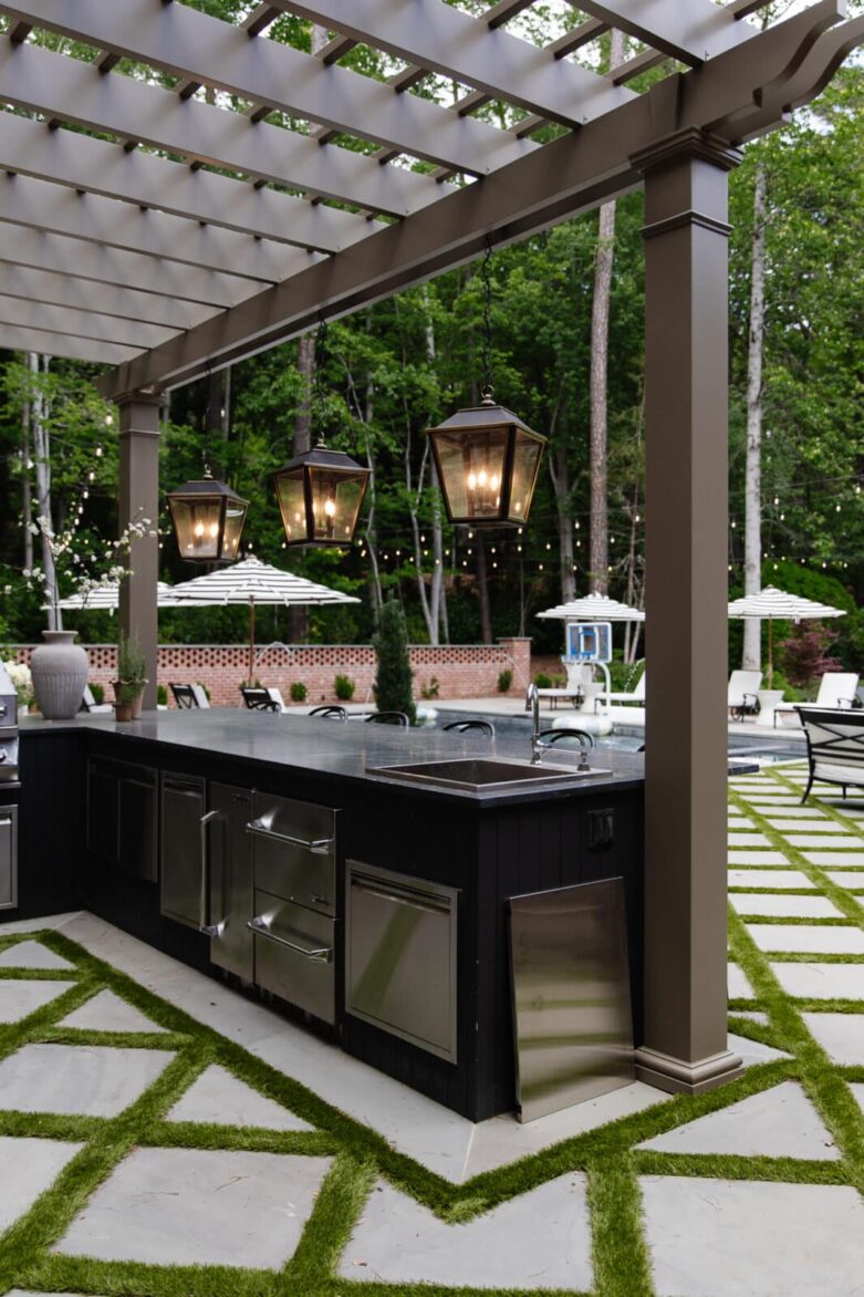 Outdoor kitchen with sink, refrigerator, and ice maker