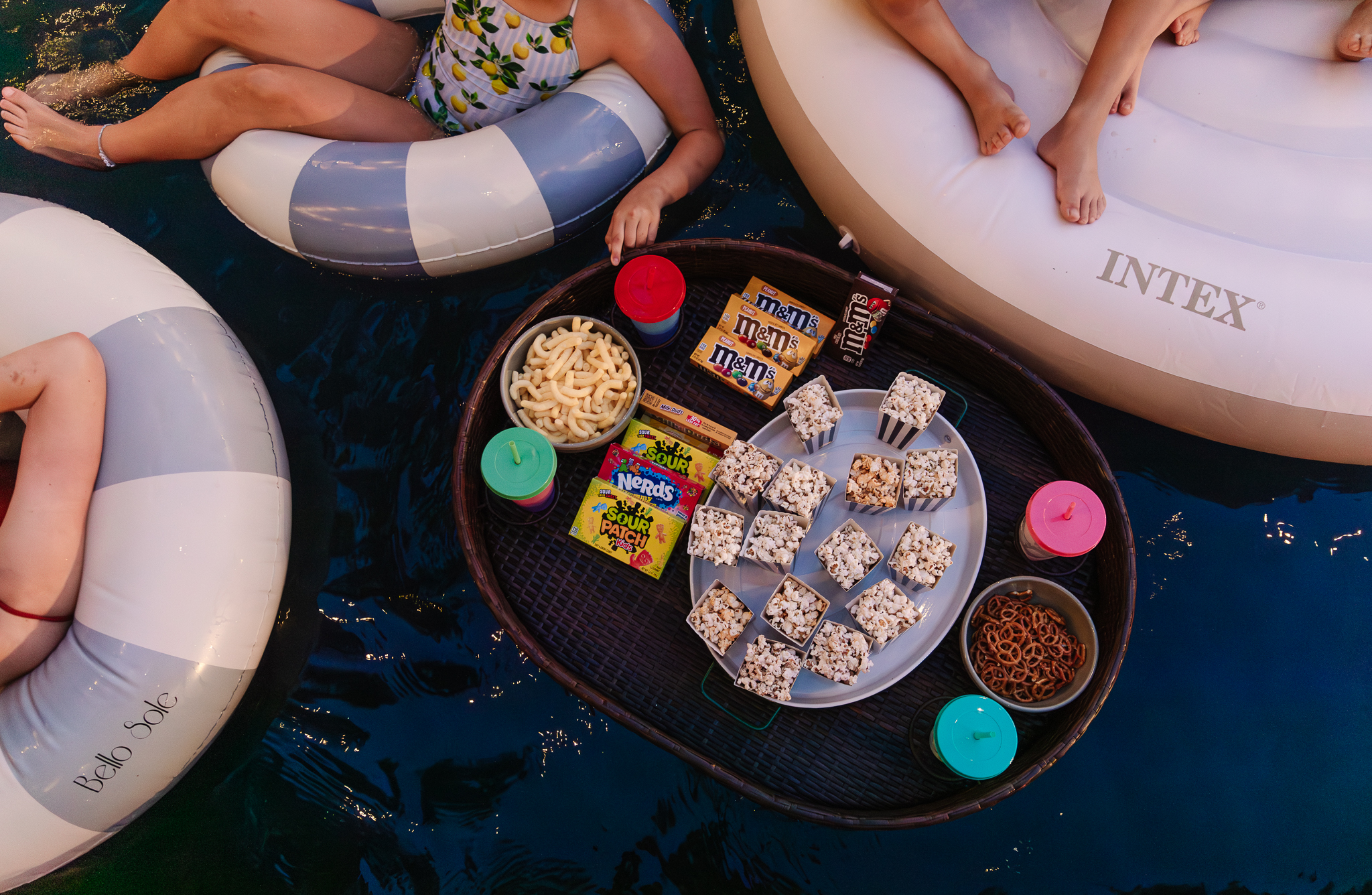 Chris Loves Julia | Outdoor movie pool party snacks in a floating tray