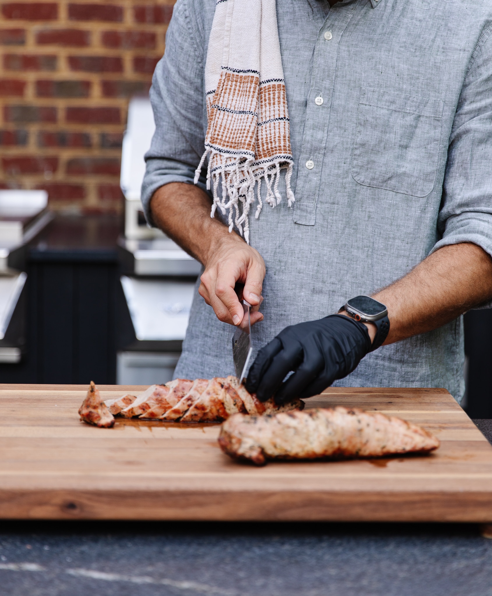 Chris Loves Julia | Chris slicing grilled pork tenderloin