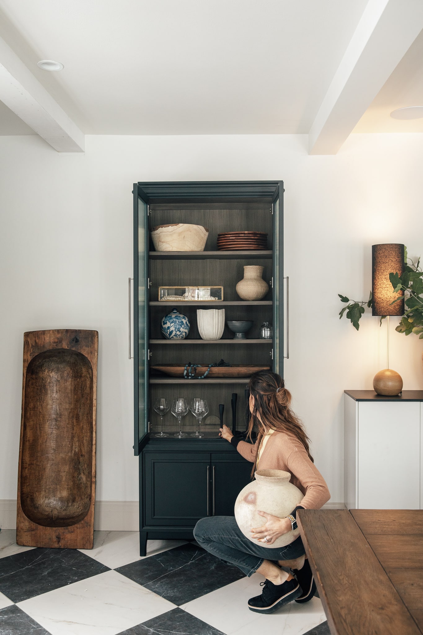 Chris Loves Julia | Julia styling a cabinet in the "Modern Cottage" in Idaho Falls