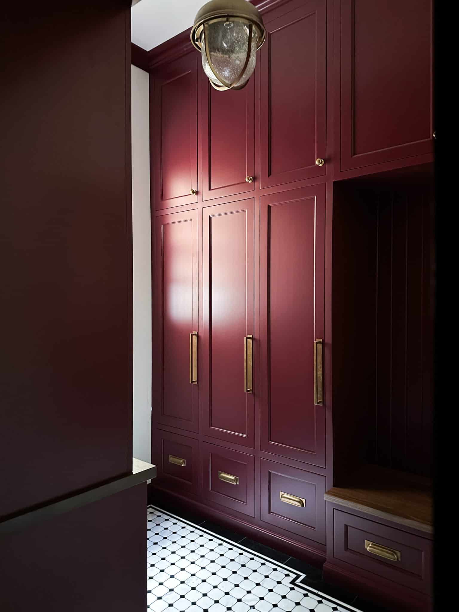 Chris Loves Julia | Mudroom with cabinets in Preference Red by Farrow & Ball