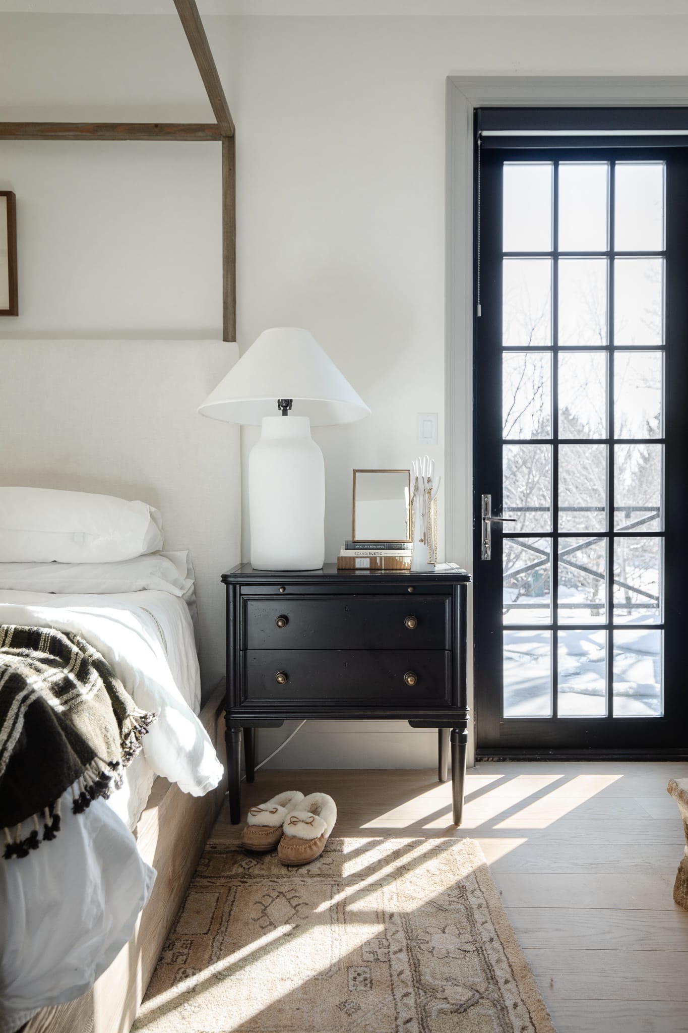 Chris Loves Julia | Black nightstand in the primary bedroom of the "Modern Cottage"