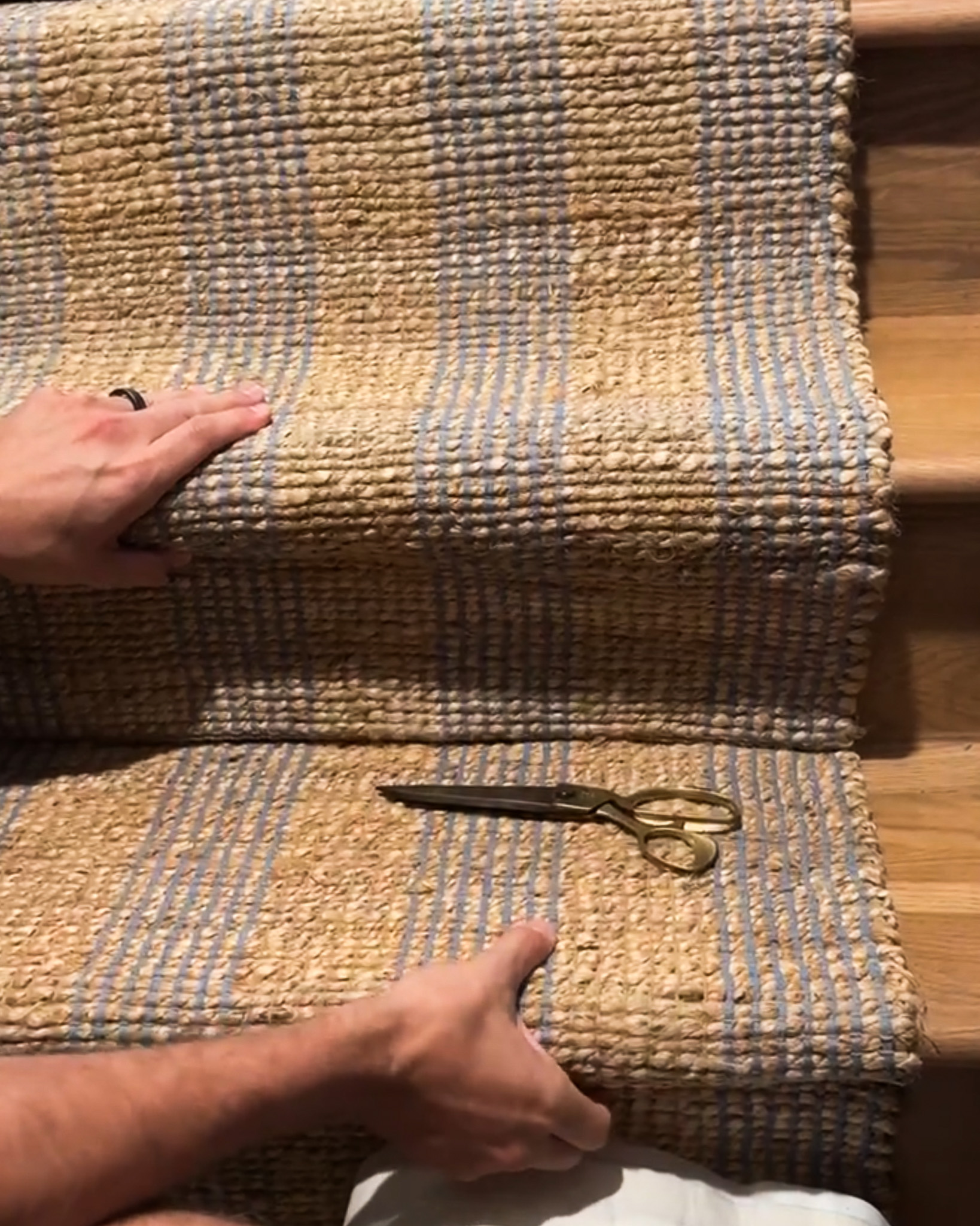 Chris Loves Julia | Chris installing the stair runner rug pads