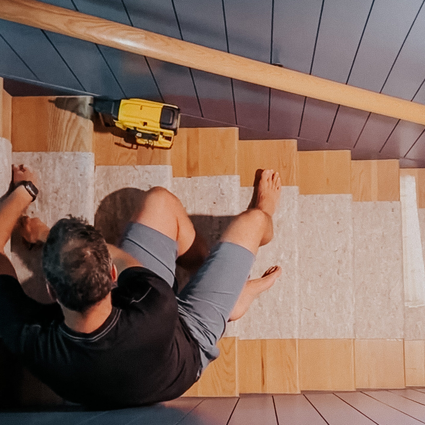 Chris Loves Julia | Chris installing the stair runner rug pads