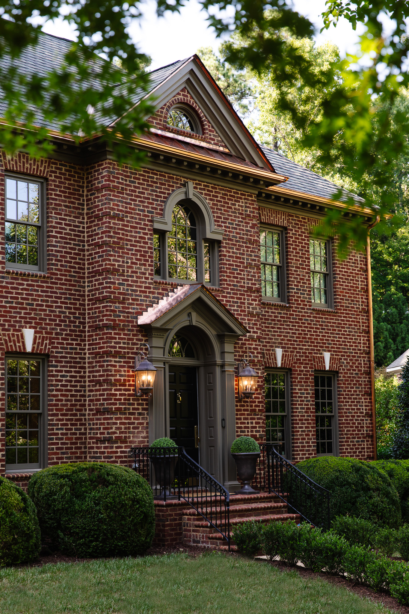 Chris Loves Julia | Traditional brick house with new copper gutters and flashing