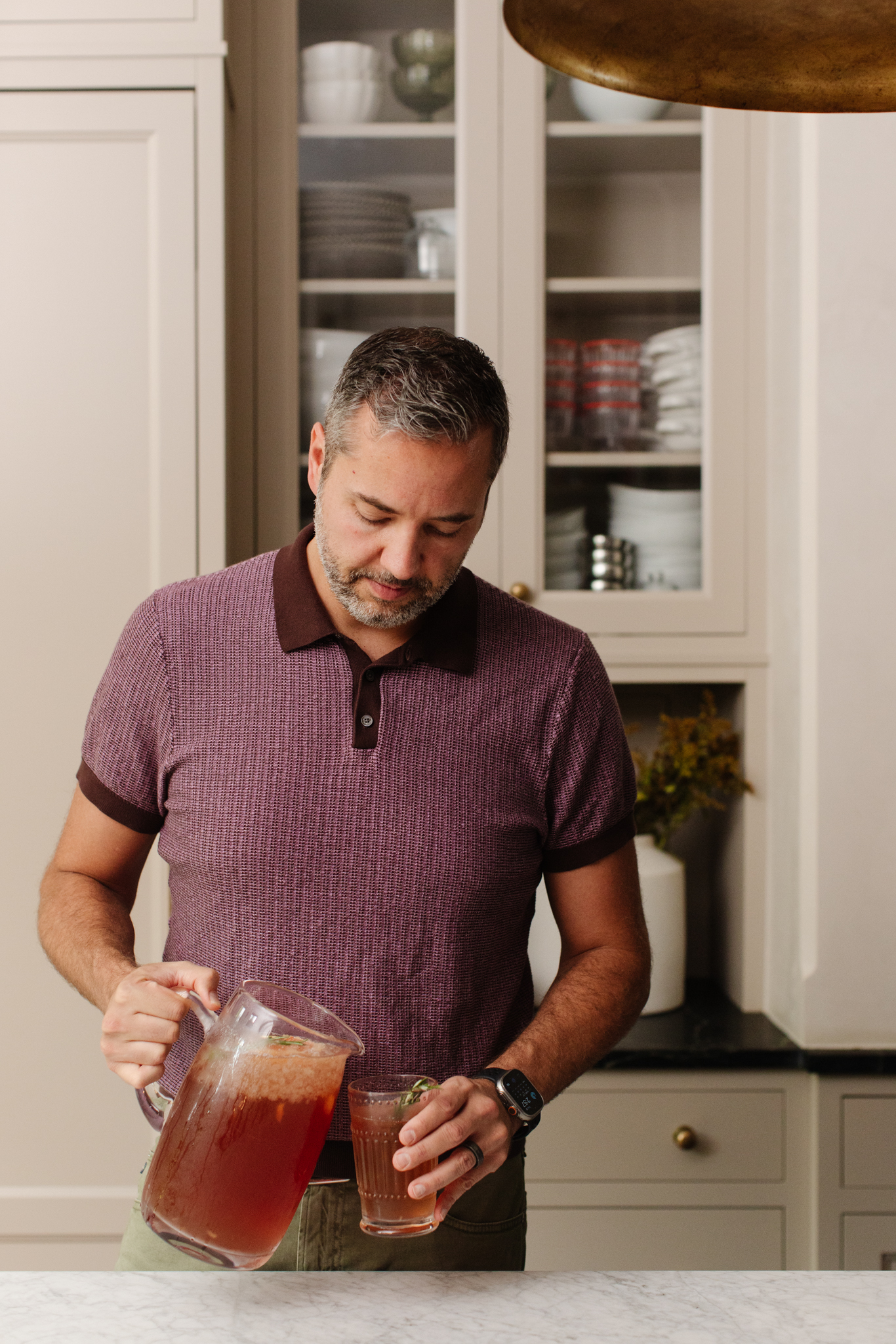 Chris Loves Julia | Chris pouring harvest punch into a glass