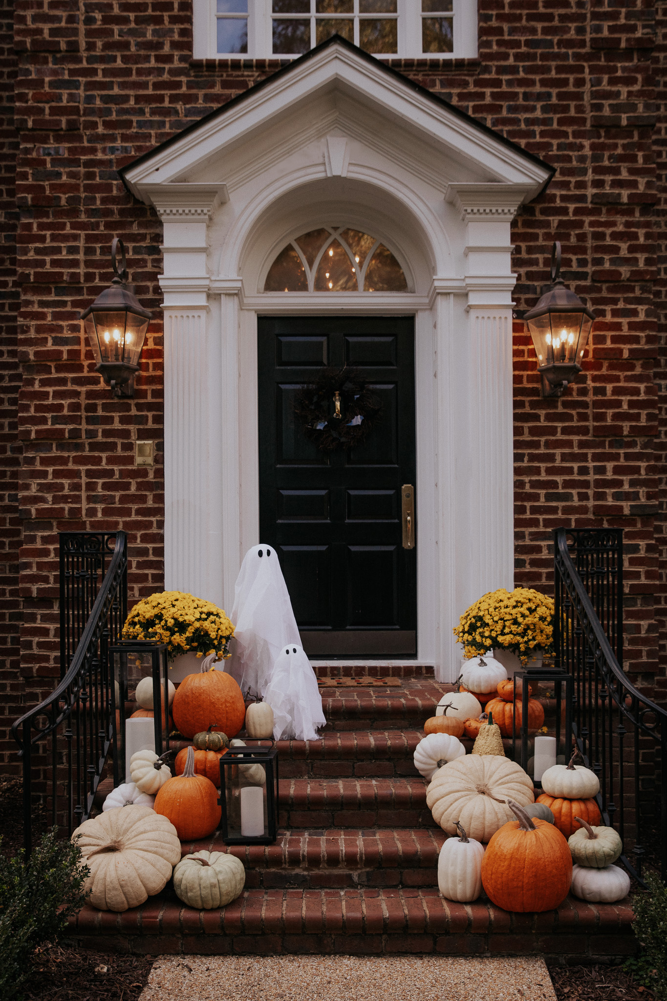 Chris Loves Julia | Front porch with pumpkins and faux ghosts