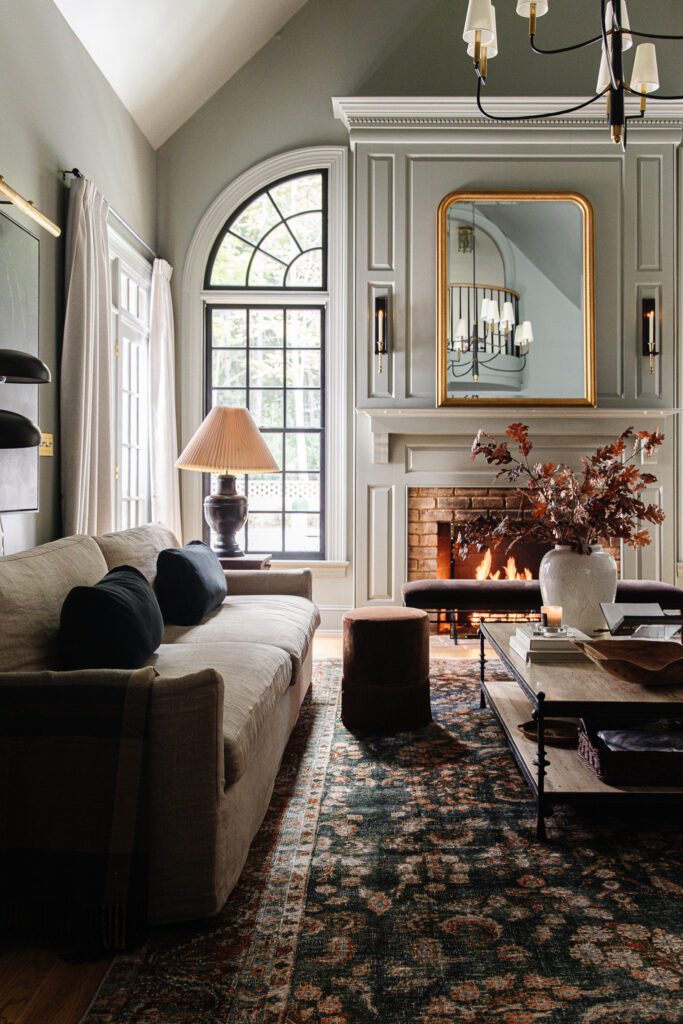 Living room with vintage-looking navy and red rug