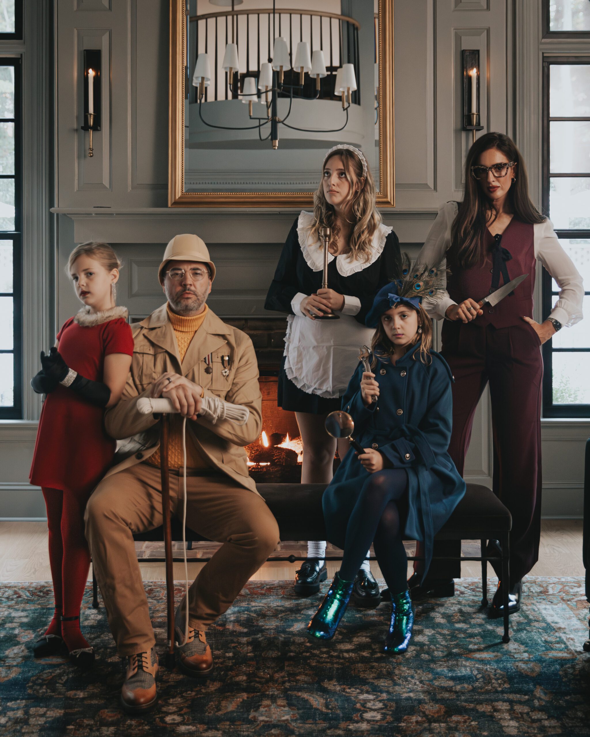 The Marcum family dressed as characters from the classic edition of Clue: The Game.