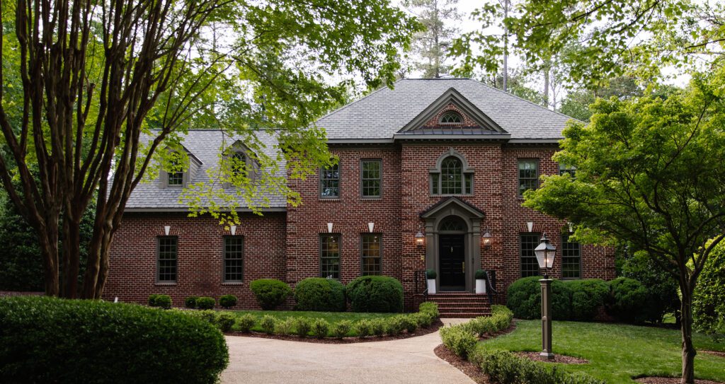Colonial Brick Home with Cromwell Gray Exterior Trim Paint (After)