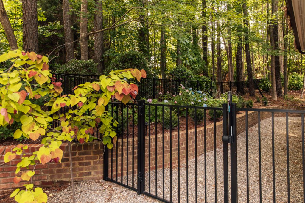 Outdoor gate with climbing vines on it