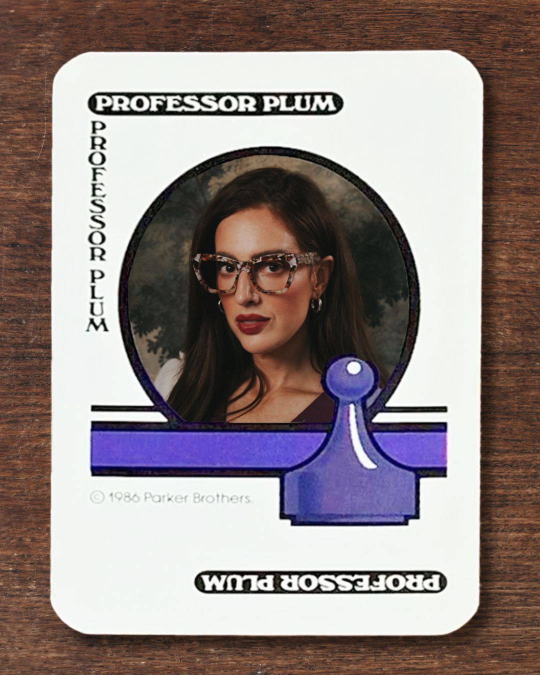 Julia dressed as Professor Plum on a classic playing card from Clue: The Game.