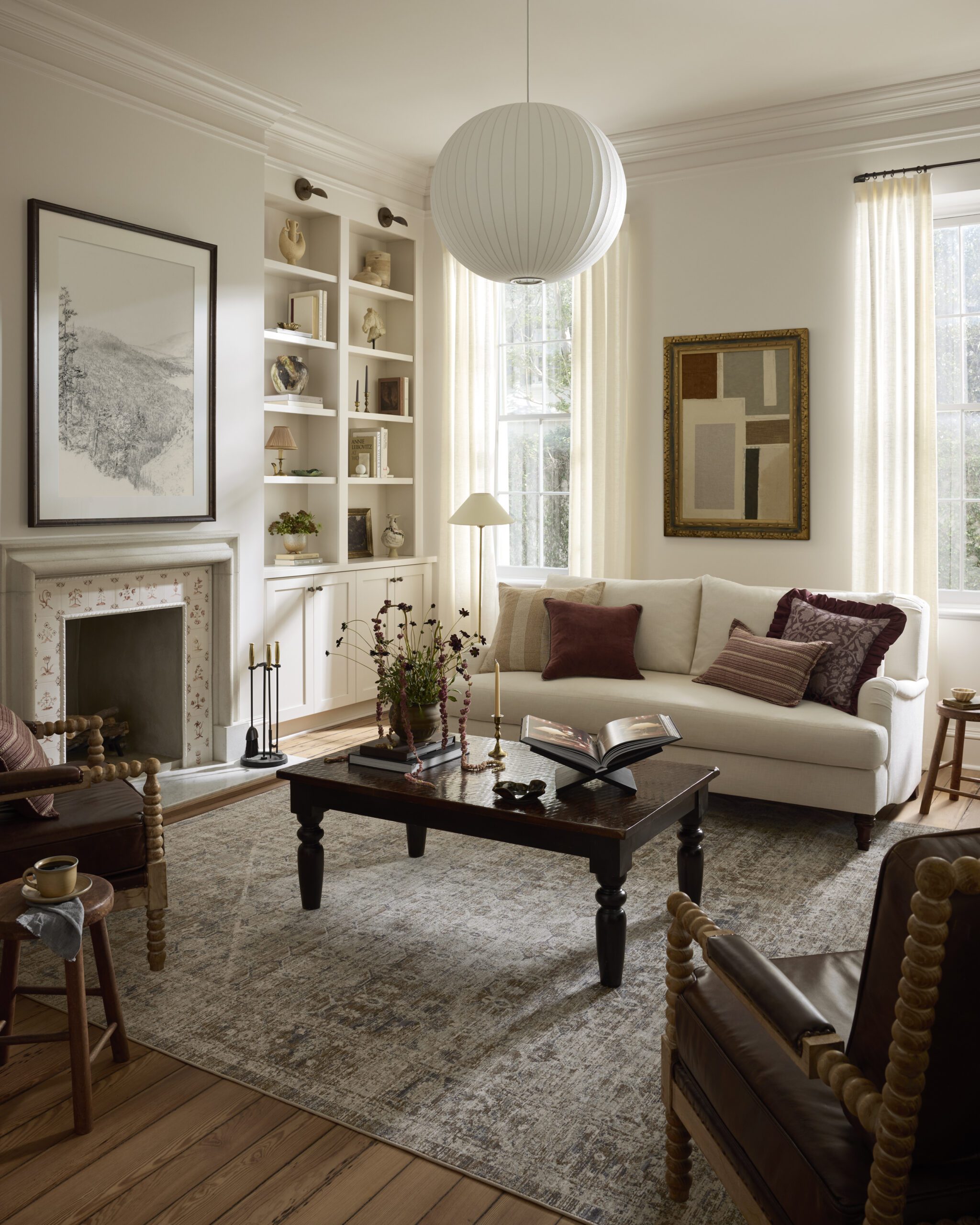 Vintage distressed rug in soothing blue, brown and cream colors in a living room