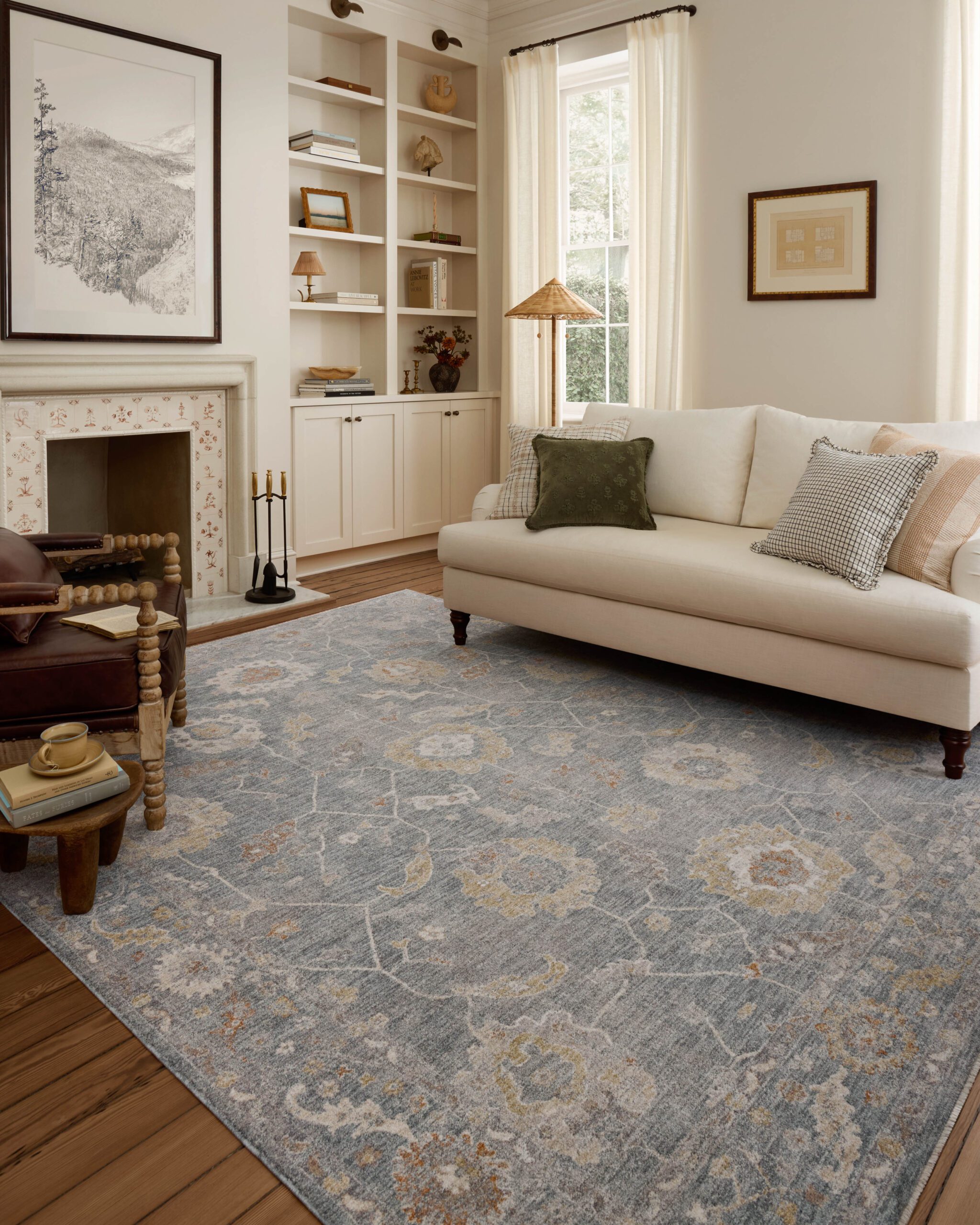 Vintage-looking blue motifs rug in a calm white living room