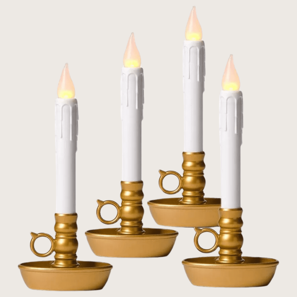 4 window candles with yellow gold candlestick holders with loops