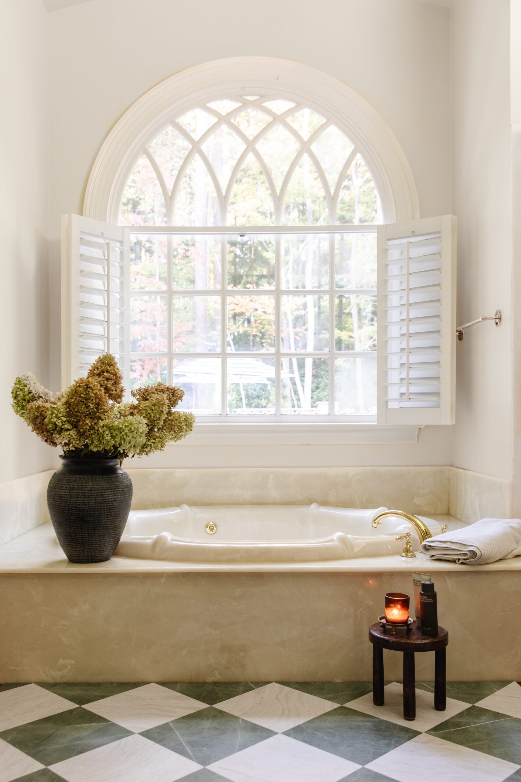 Primary bathroom with a floor featuring green & white marble checkerboard floor tiles