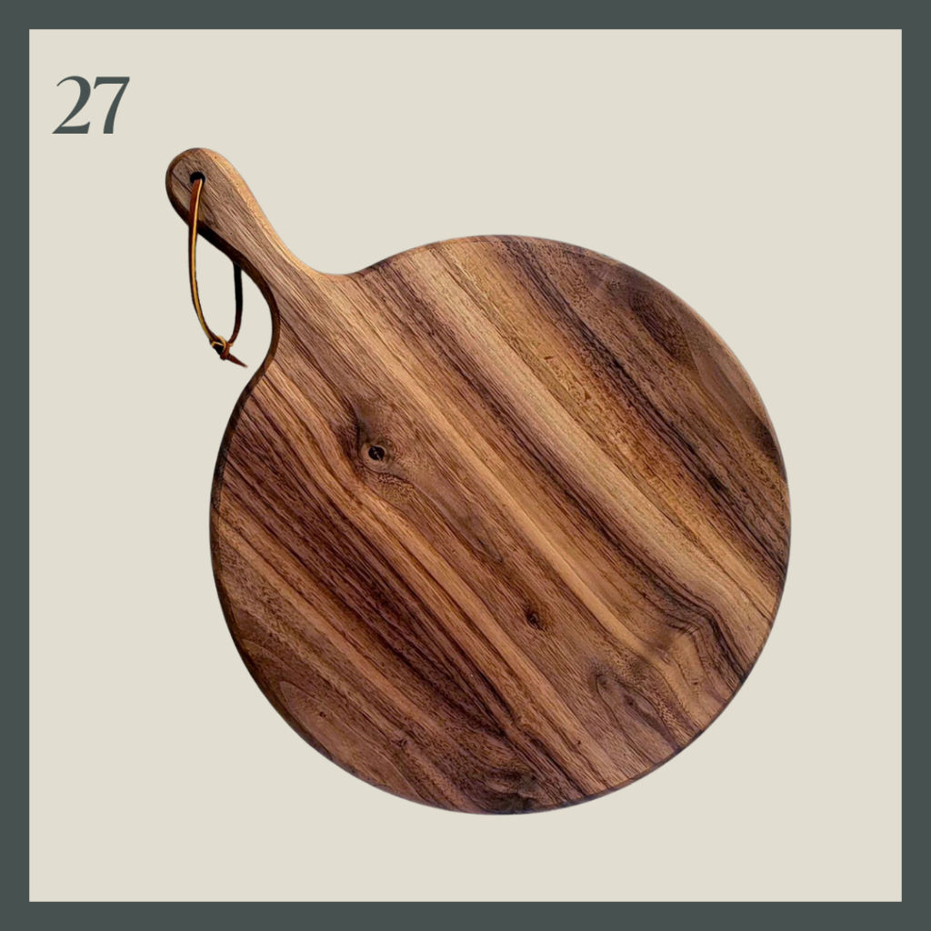 A round walnut board with handle