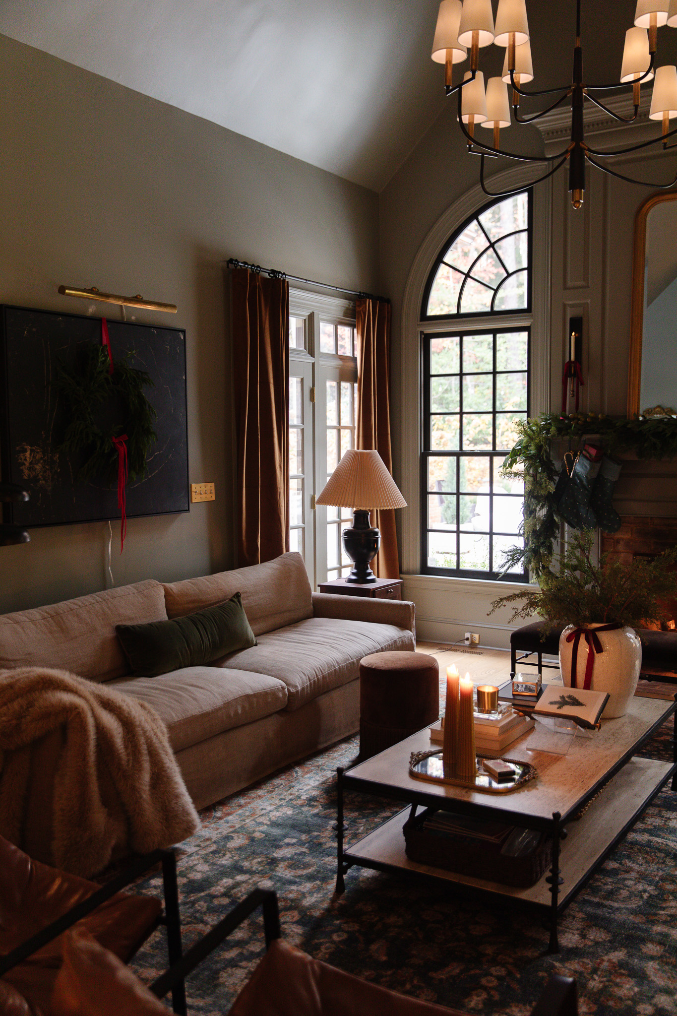 Living room with Christmas decorations and ochre velvet curtains