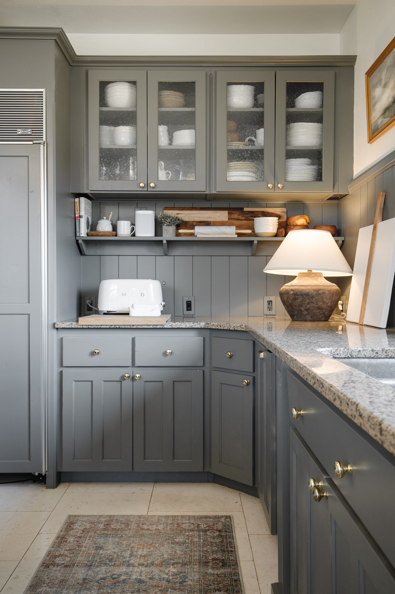 Chris & Julia's Idaho Falls kitchen with gray cabinets that end a foot away from the ceiling.