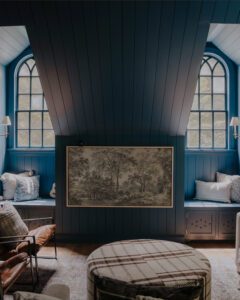 Blue bonus room with paneled ceiling and Frame TV