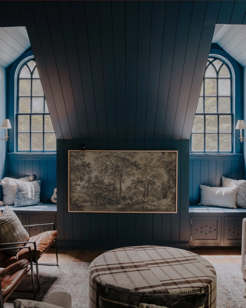 Blue bonus room with paneled ceiling and Frame TV