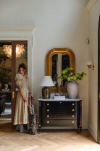Julia in her entry wearing a smocked floral midi dress with statement sleeves