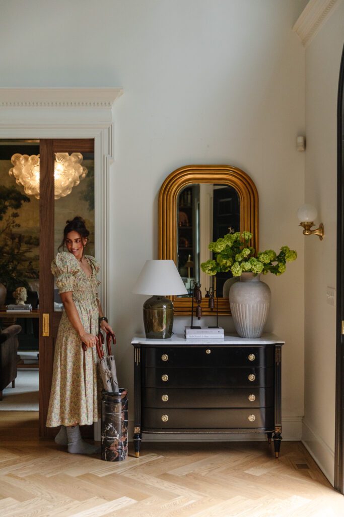Julia in her entry wearing a smocked floral midi dress with statement sleeves