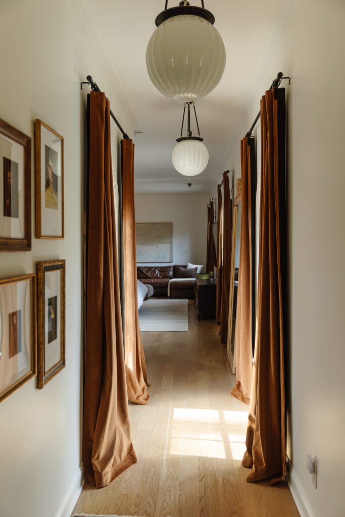 Curtain rods in the hallway and playroom to make it a temporary bedroom