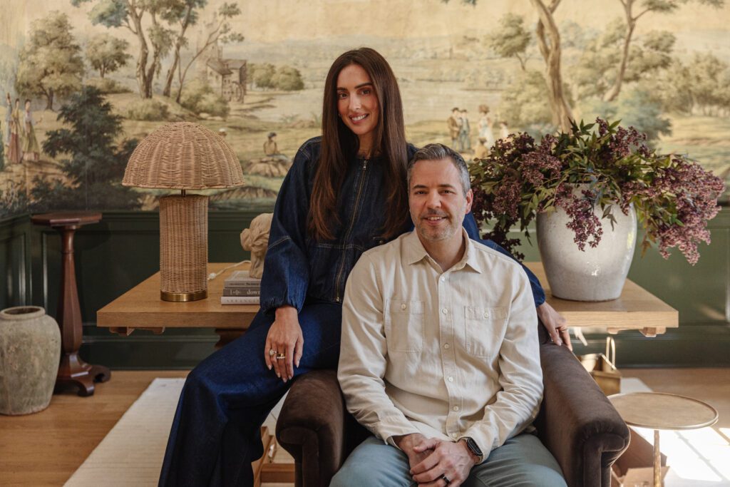 Chris and Julia in the study nest to a rattan lamp