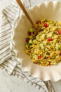 Grilled corn and pineapple salad with honeydew melon, green onions, and cilantro