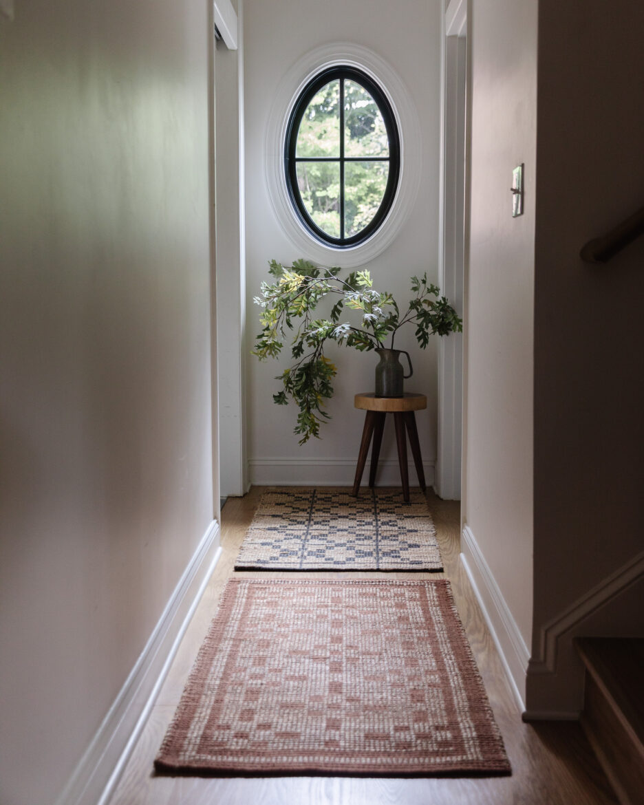 Accent runners in two different patterns lining a hallway