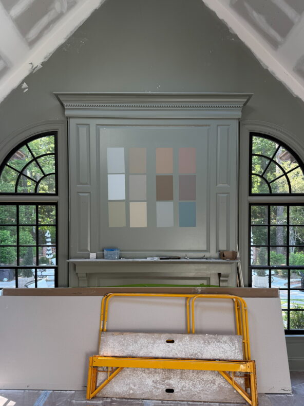 Samples of Farrow & Ball paint colors on the living room mantle