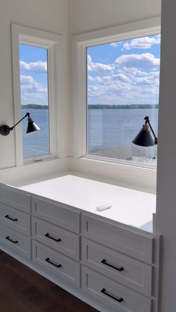 A dresser witha. view of the lake