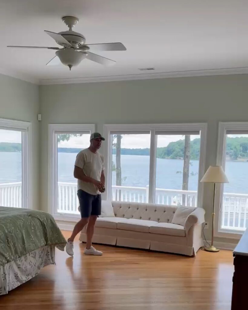 Chris walking through a part of the lake house