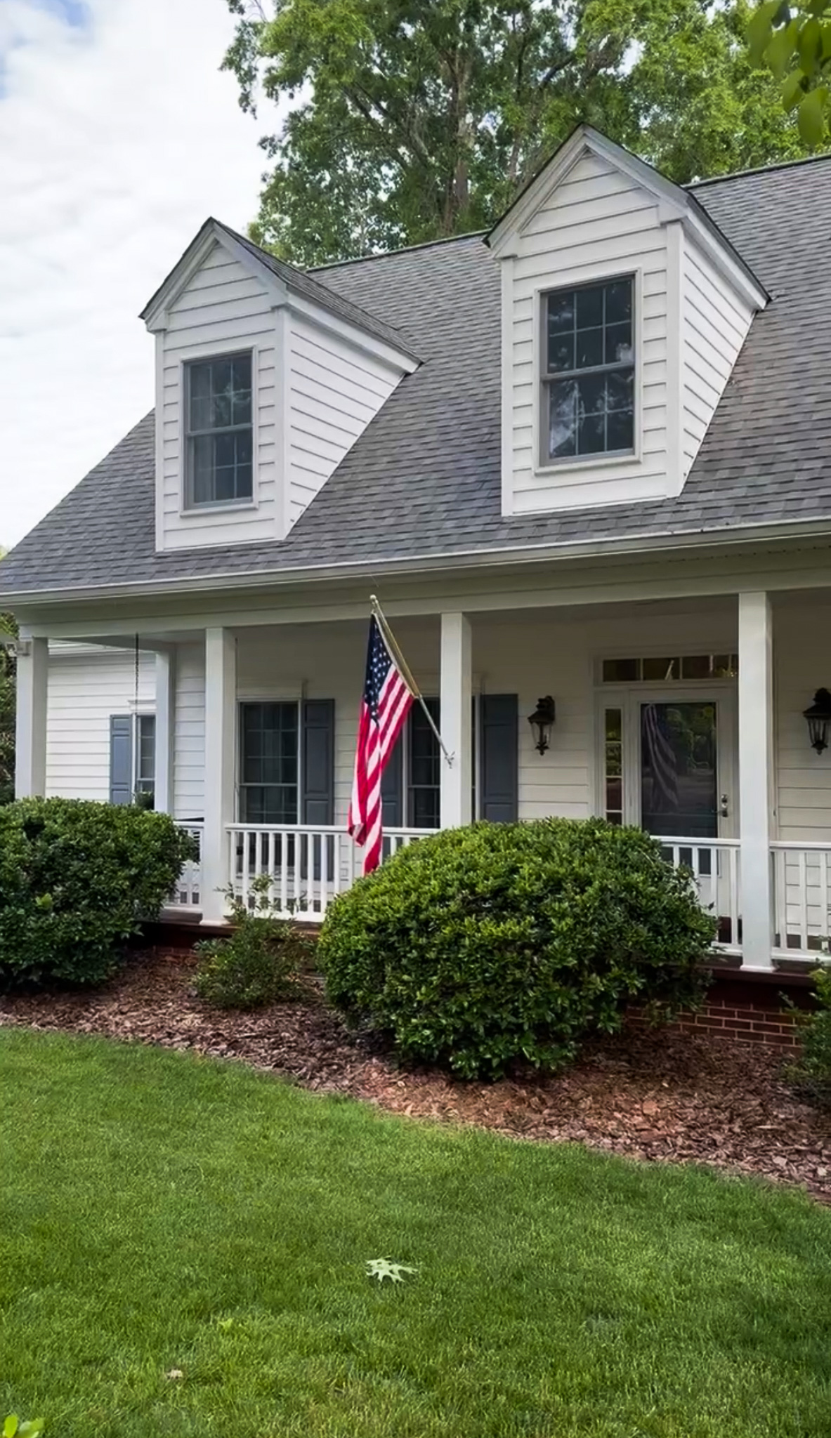 A Colonial-style white house with columns