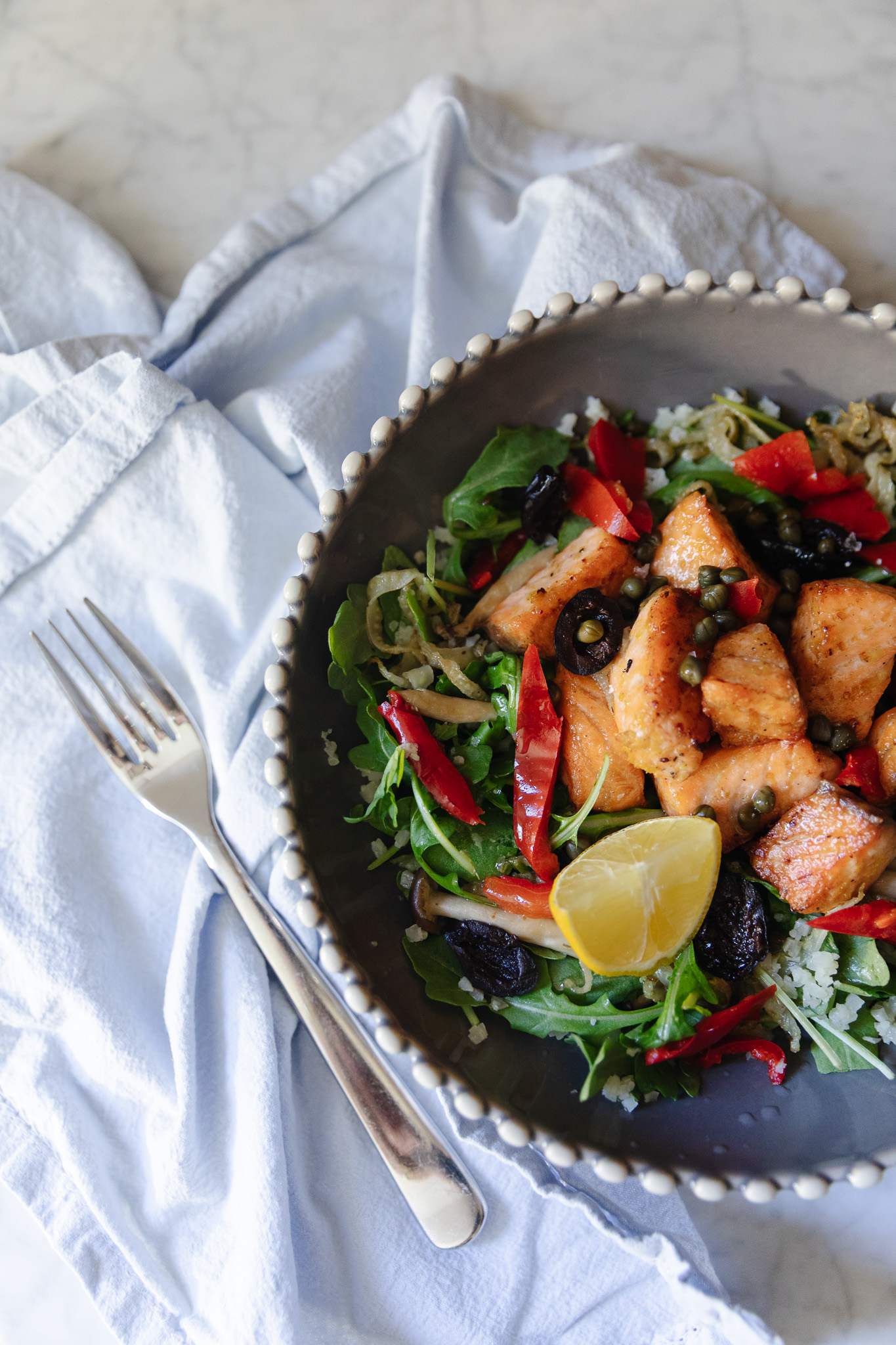 Mediterranean-Inspired Salmon Bowls on a counter