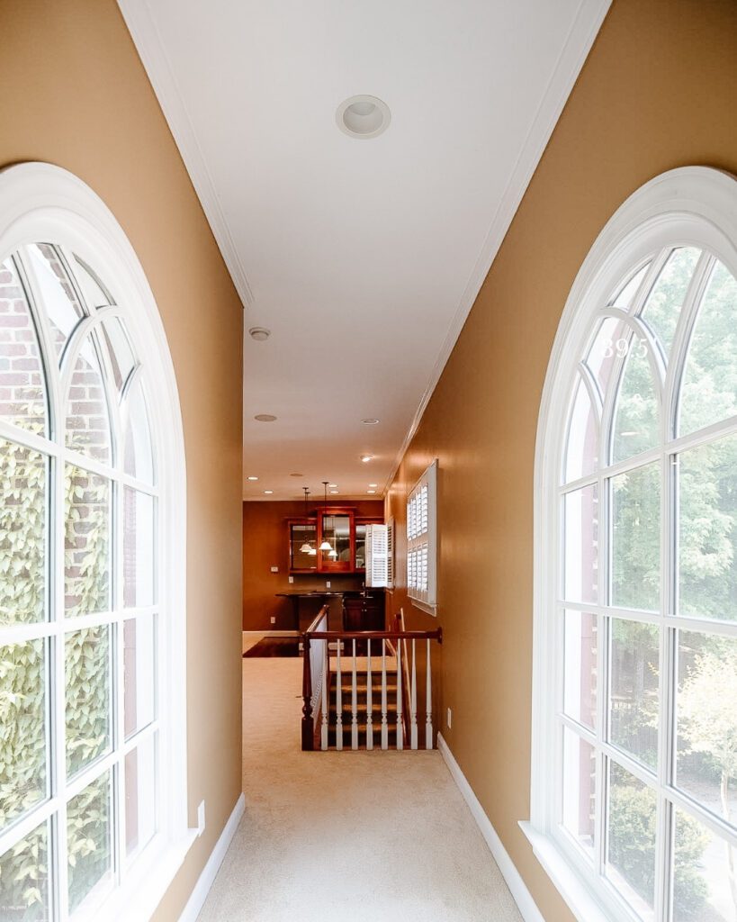 Dated hallway with can lights
