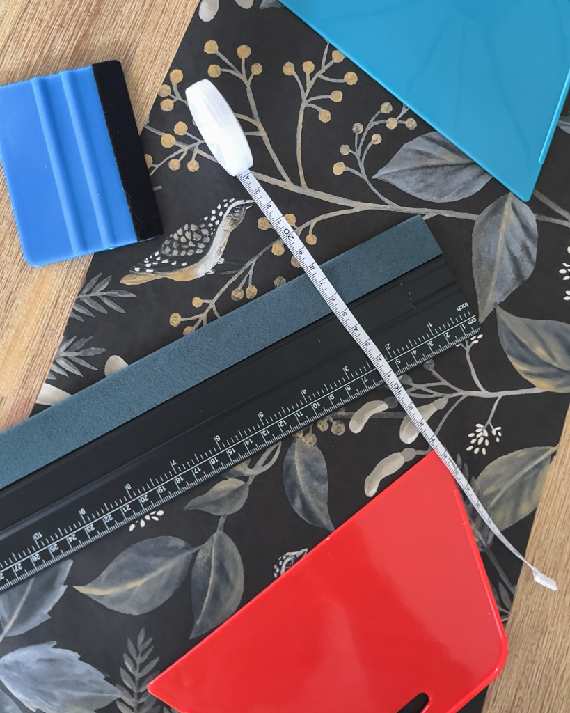 Supplies to hang peel-and-stick wallpaper