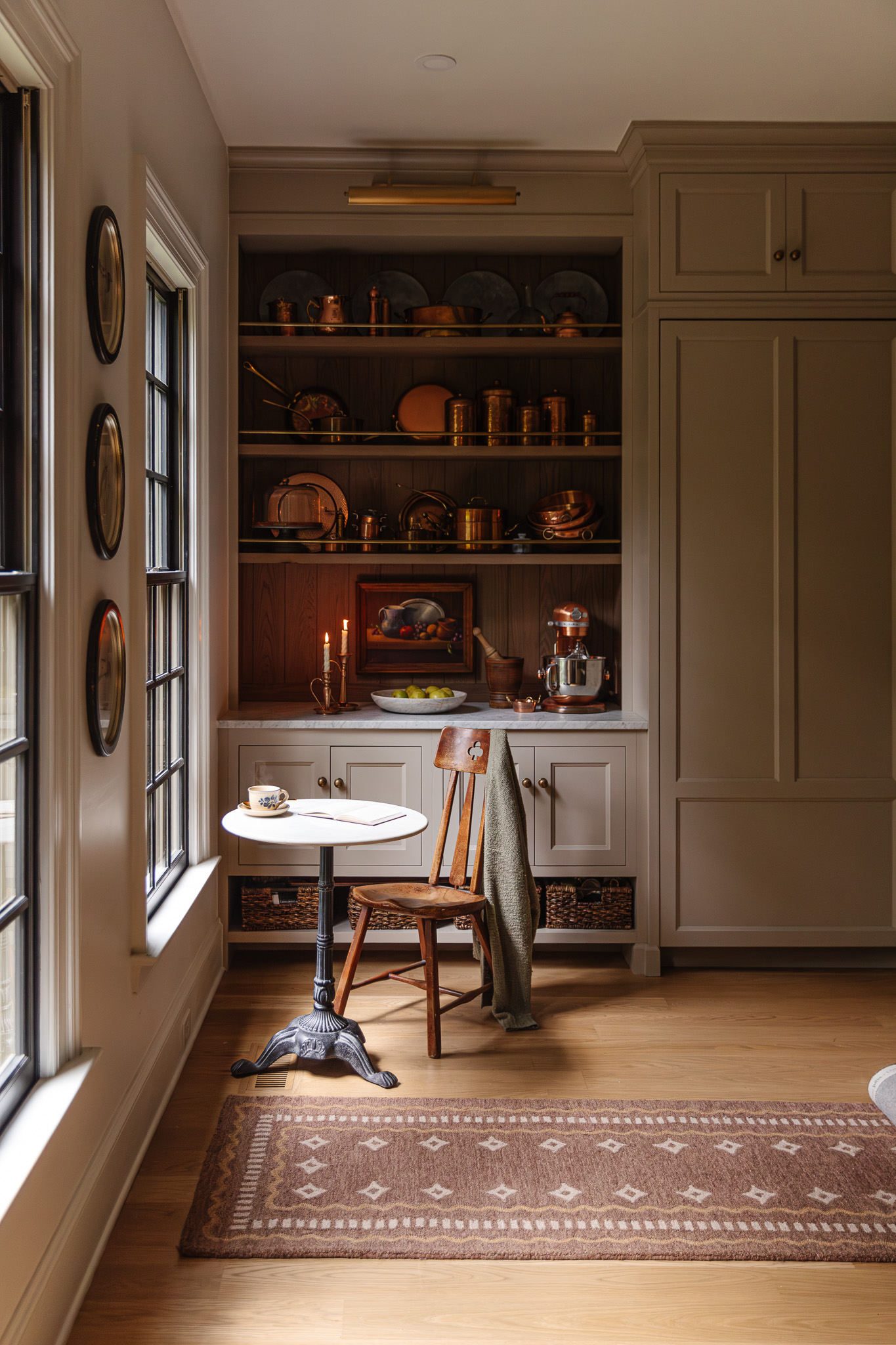 A dark brown Alfie rug from the Chris Loves Julia x Loloi collection in a kitchen